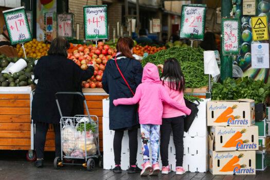  Shoppers gather to buy fruit and vegetables at a store in the suburb of Fairfield in Sydney, Australia, on July 9, 2021. (Lisa Maree Williams/Getty Images)