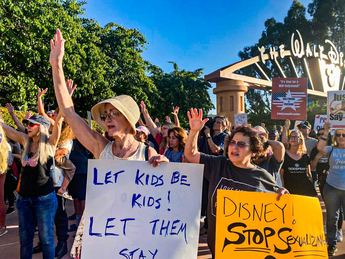  Protesters rally in opposition to The Walt Disney Co.'s stance against a recently passed Florida law outside of the company's headquarters in Burbank, Calif., on April 6, 2022. (Jill McLaughlin/The Epoch Times)