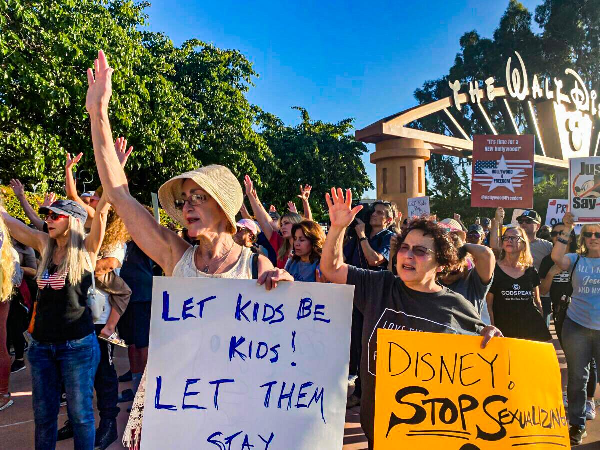 Protesters rally in opposition to The Walt Disney Co.'s stance against a recently passed Florida law outside of the company's headquarters in Burbank, Calif., on April 6, 2022. (Jill McLaughlin/The Epoch Times)