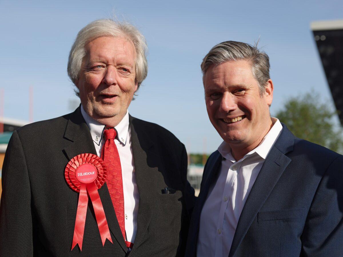 Labour Party leader Keir Starmer poses with Barnet Labour leader Barry Rawlings as he congratulates winning Labour Councillors at StoneX Stadium in Barnet, England, on May 6, 2022. (Hollie Adams/Getty Images)