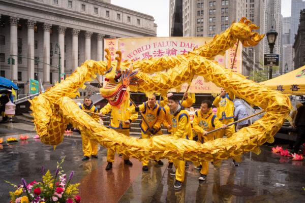 Falun Dafa practitioners take part in an event to celebrate World Falun Dafa Day in Foley Square in New York City on May 7, 2022. (Samira Bouaou/The Epoch Times)