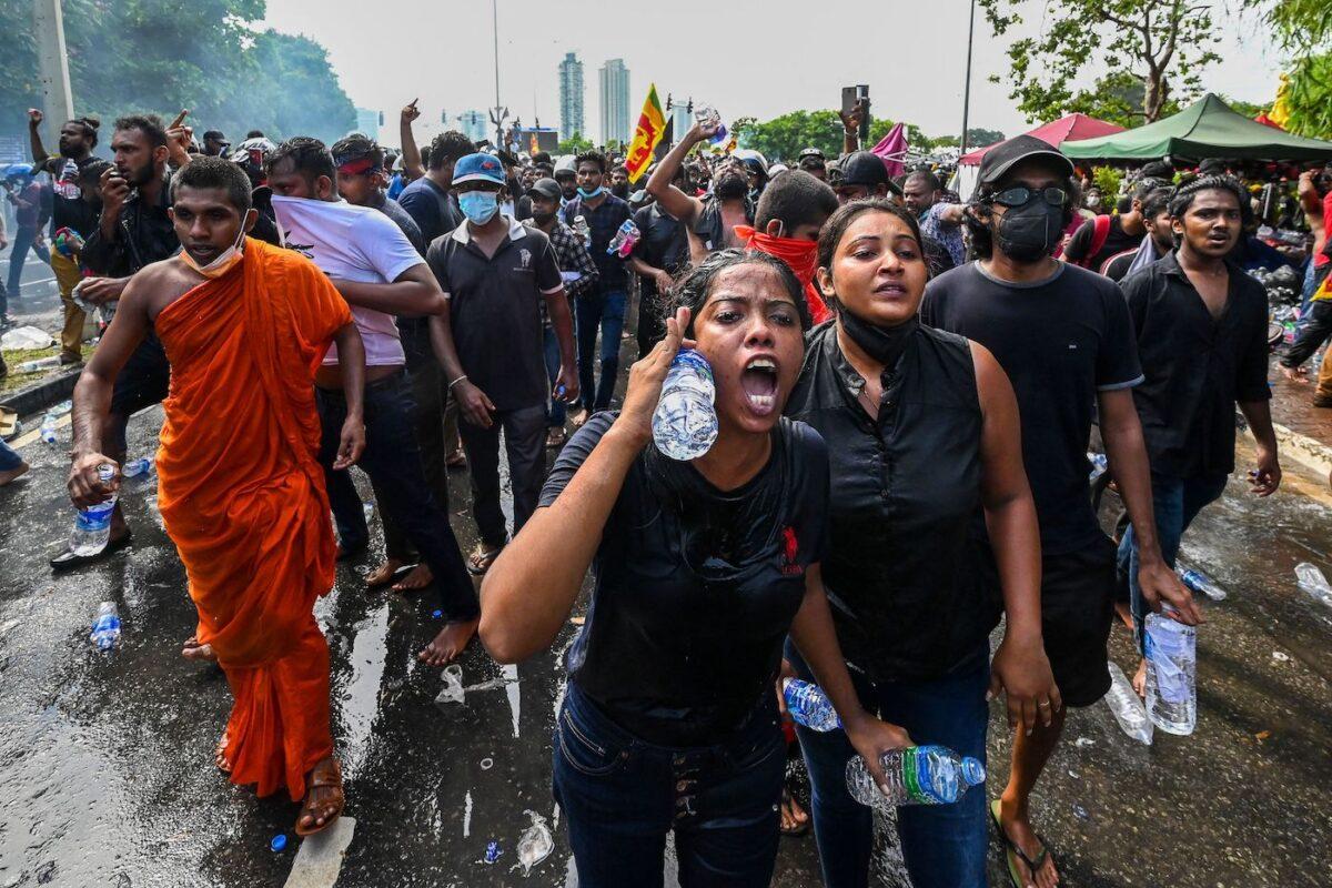 University students take part in a demonstration demanding the resignation of Sri Lanka's Prime Minister Gotabaya Rajapaksa over the country's crippling economic crisis, near the parliament building in Colombo on May 6, 2022. (Ishara S. Kodikara/AFP via Getty Images)