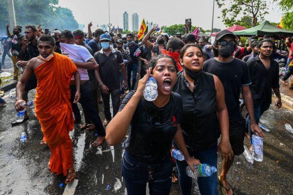 University students take part in a demonstration demanding the resignation of Sri Lanka's President Gotabaya Rajapaksa over the country's crippling economic crisis, near the parliament building in Colombo on May 6, 2022. (Ishara S. Kodikara/AFP via Getty Images)