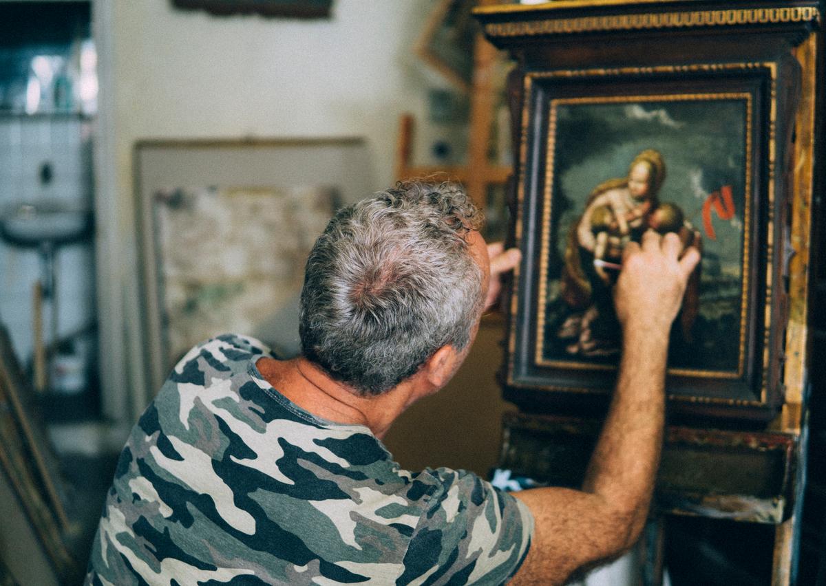 If the painting is very valuable or has sentimental value, leave any restoration beyond a light dusting to an expert. (Carlo107/Getty Images)