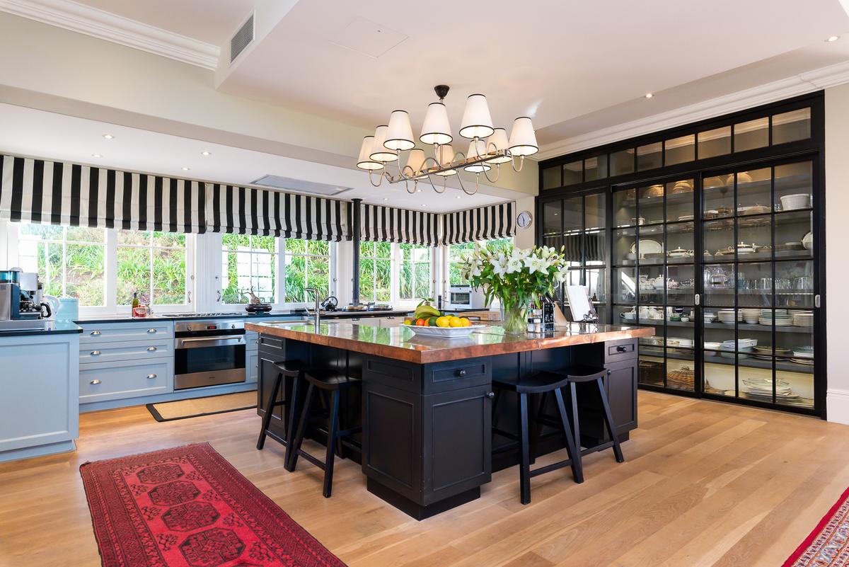 Throughout the spacious gourmet kitchen can be seen meticulous attention to craftsmanship melded into efficiency. There are also two wine bars in the main house. (Greef Christie’s International Real Estate)