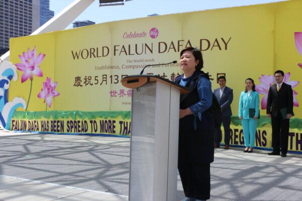 Gloria Fung, president of Canada-Hong Kong Link, speaks during a rally in downtown Toronto on May 7, 2022, commemorating the 30th anniversary of the spreading of Falun Gong. (Andrew Chen/The Epoch Times)