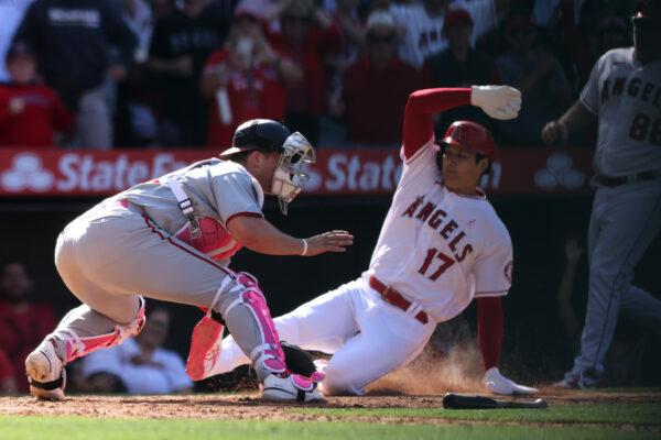 Shohei Ohtani #17 of the Los Angeles Angels scores against Riley Adams #15 of the Washington Nationals in the ninth inning at Angel Stadium of Anaheim, in Anaheim, on May 8, 2022. (Katharine Lotze/Getty Images)