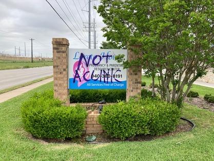 A vandal left pro-abortion slogans on a sign for Loreto House, a crisis pregnancy center in Denton, Texas, on May 7, 2022. (Courtesy of Loreto House)