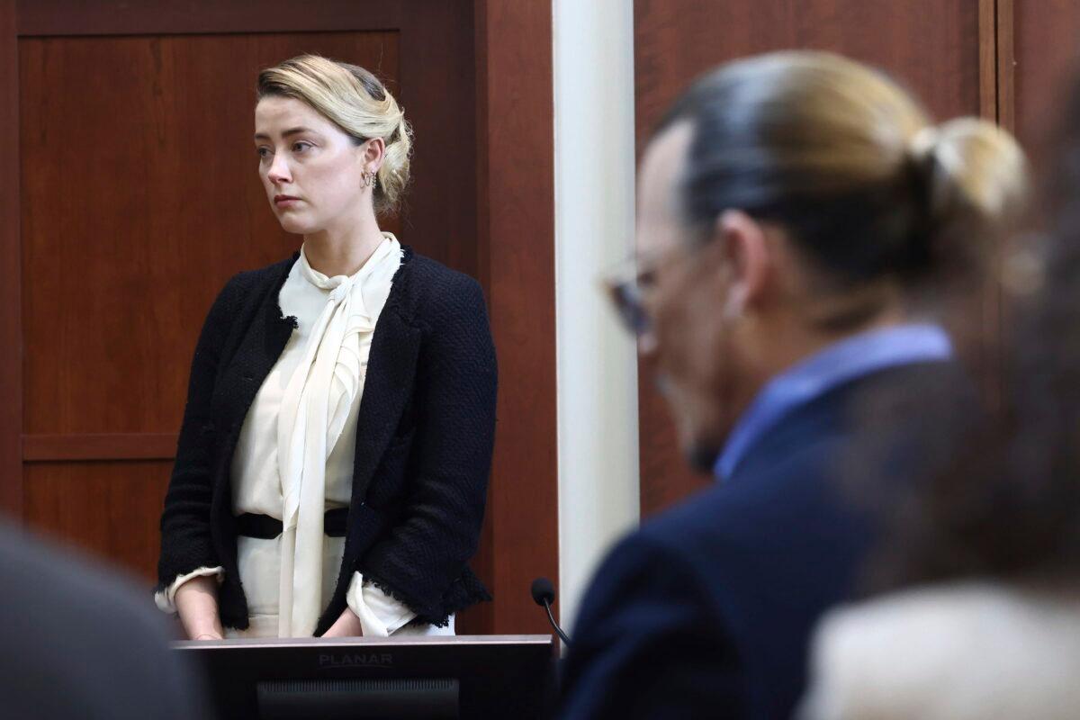Actor Amber Heard and actor Johnny Depp appear in the courtroom at the Fairfax County Circuit Court in Fairfax, Va., on May 5, 2022. (Jim Lo Scalzo/Pool Photo via AP)