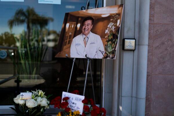 A photo of Dr. John Cheng, a 52-year-old victim who was killed in Sunday's shooting at Geneva Presbyterian Church, outside his office in Aliso Viejo, Calif., on May 16, 2022. (Jae C. Hong/AP Photo)