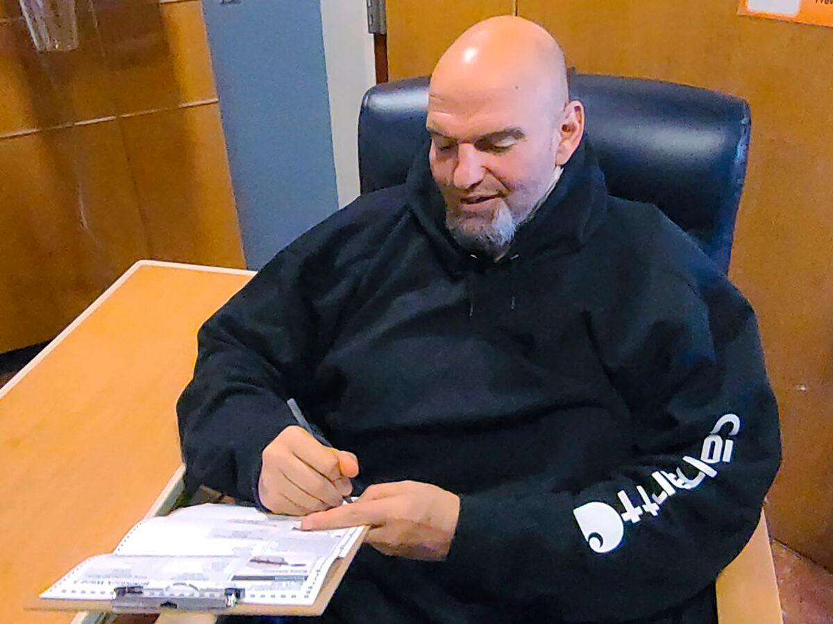 John Fetterman fills out his emergency absentee ballot for the Pennsylvania primary election in Penn Medicine Lancaster General Hospital in Lancaster, Pa., on May, 17, 2022. (Bobby Maggio via AP)