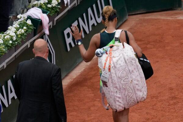 Japan's Naomi Osaka leaves after losing against Amanda Anisimova of the United States during their first round match at the French Open tennis tournament in Roland Garros stadium in Paris, on May 23, 2022. (Christophe Ena/AP Photo)
