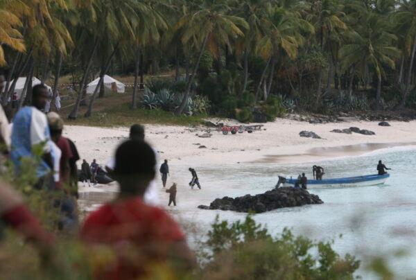 Rescuers gather at Galawa Beach, 35 kilometers from Moroni, as they prepare to search the area after a Yemenia Airbus passenger plane crashed into the Indian Ocean off the island nation of Comoros on June 30, 2009, as it attempted to land in the dark amid howling winds, in Comoros, on July 1, 2009. (Sayyid Azim/AP Photo)