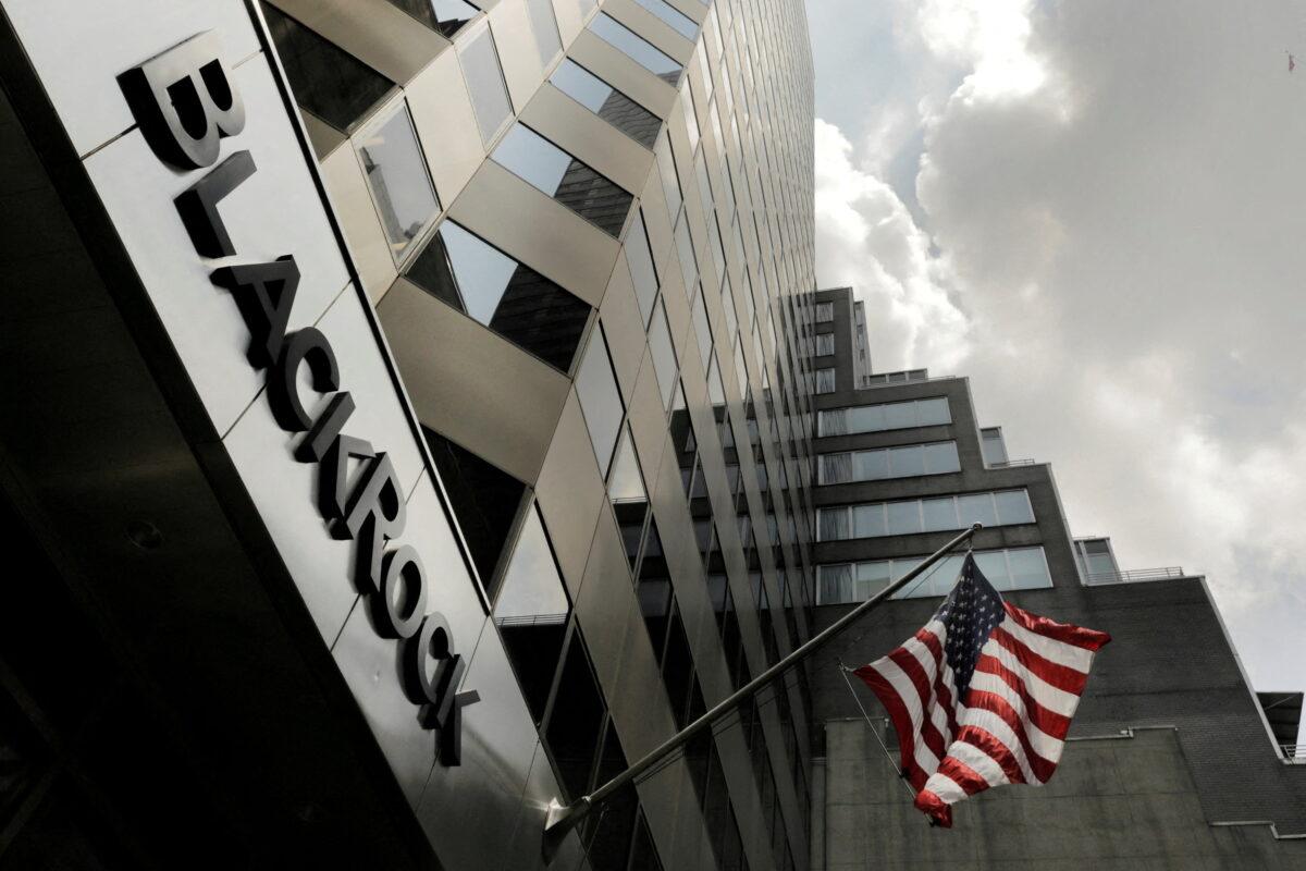 A sign for BlackRock Inc. hangs above the company's building in New York on July 16, 2018. The company has recently set up its first independent investment fund of over $1 billion in China. (Lucas Jackson/Reuters)