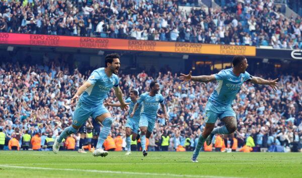 Manchester City's Ilkay Gundogan celebrates scoring their third goal with Gabriel Jesus during the Premier League match between Manchester City and Aston Villa at Etihad Stadium in Manchester, England, on May 22, 2022. (Hannah Mckay/Reuters)