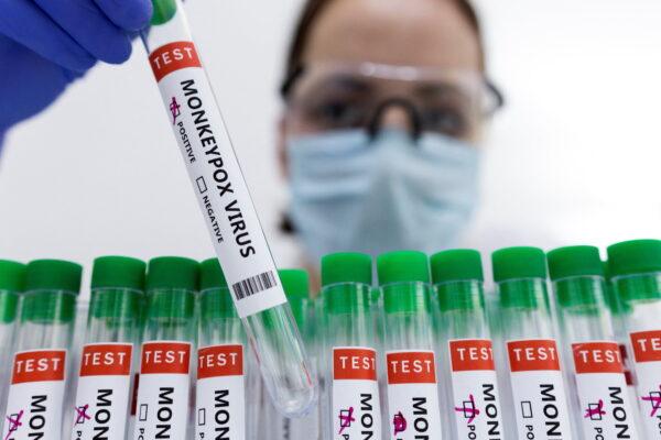 Test tubes labeled "Monkeypox virus positive" in an illustration taken on May 23, 2022. (Dado Ruvic/Reuters)