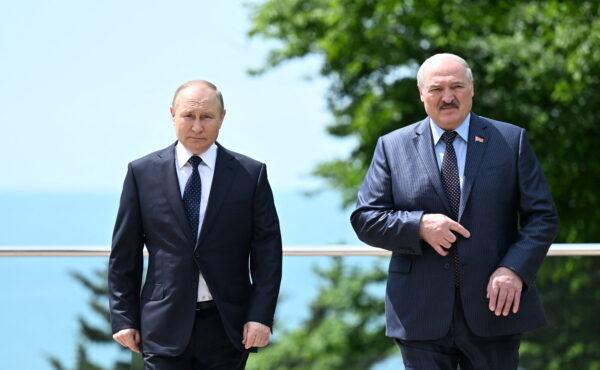 Russian President Vladimir Putin (L) and Belarusian President Alexander Lukashenko (R) walk during a meeting in Sochi, Russia, on May 23, 2022. (Sputnik/Ramil Sitdikov/Kremlin via Reuters)