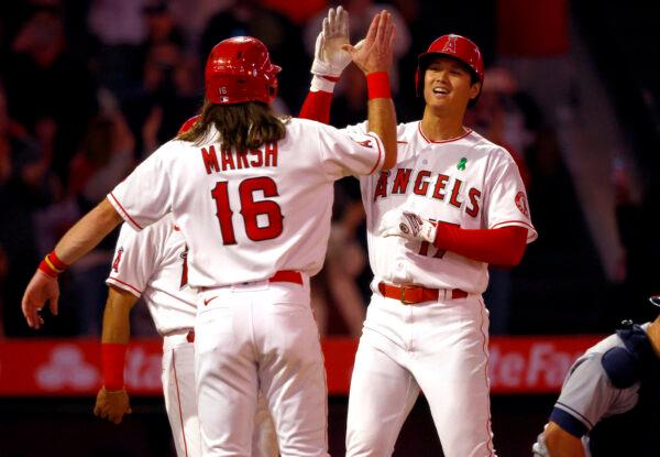 Shohei Ohtani #17 of the Los Angeles Angels celebrates after hitting a grand slam with Brandon Marsh #16 against the Tampa Bay Rays in the seventh inning at Angel Stadium of Anaheim, in Anaheim, on May 9, 2022. (Ronald Martinez/Getty Images)