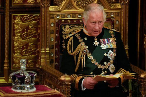 Prince Charles reads the Queen's Speech as he sits by the Imperial State Crown, in the House of Lords chamber, during the State Opening of Parliament, at the Houses of Parliament in London, on May 10, 2022. (Alastair Grant /Pool/AFP via Getty Images)