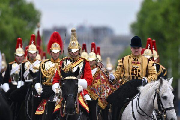 Members of the Household Cavalry ride down The Mall as they return to barracks after attending the State Opening of Parliament ceremony, at the Houses of Parliament in London, on May 10, 2022. (Glyn Kirk /AFP via Getty Images)