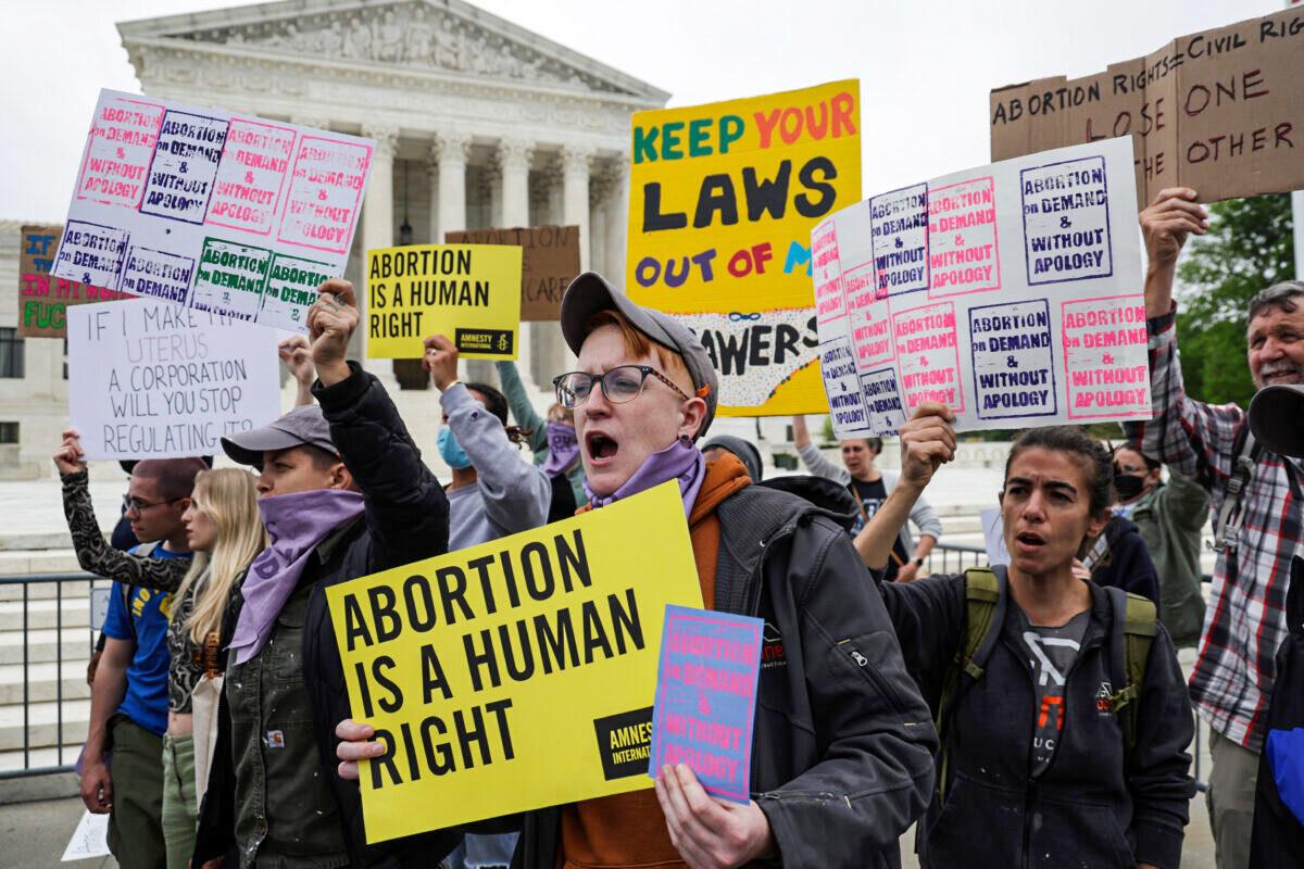 Pro-abortion activists protest in front of the Supreme Court in response to a leaked draft opinion showing the court's intention to overturn Roe v. Wade, in Washington, on May 3, 2022. (Alex Wong/Getty Images)