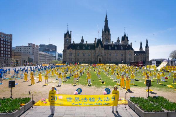 Falun Gong adherents celebrate the 30th anniversary of the introduction of the spiritual practice in a rally in Ottawa on May 10, 2022. (Evan Ning/The Epoch Times)