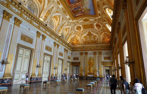 The Throne Room is one of 40 large rooms considered to be “monumental” at Caserta’s Royal Palace. This marvel of Italian Baroque architecture features a large arched ceiling covered in elaborate gold-painted stucco work in addition to a large central fresco. Massive doors line the glimmering hall with door handles that are at the height of most people’s heads. (Richard Mortel/Flickr/CC BY 2.0)