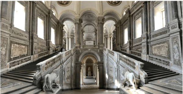 Entering the Royal Palace, the “Grand Staircase of Honor” is a truly monumental and exquisite architectural feat. The long stairways are lined by walls and columns of colored marble. Arched ceilings soar multiple stories above giving the visitor the sensation of being in a vast open space of great significance. (Anna & Michal/Flickr/CC BY SA 2.0)