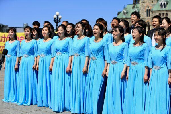 Falun Gong adherents perform in celebration of the 30th anniversary of the introduction of the spiritual practice, in Ottawa on May 10, 2022. (Jonathan Ren/The Epoch Times)