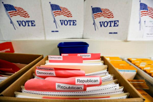 Ballots for the primary elections are arranged by party affiliation at the Lancaster County Election Committee offices in Lincoln, Neb., in April 2020. (Nati Harnik/AP photo)