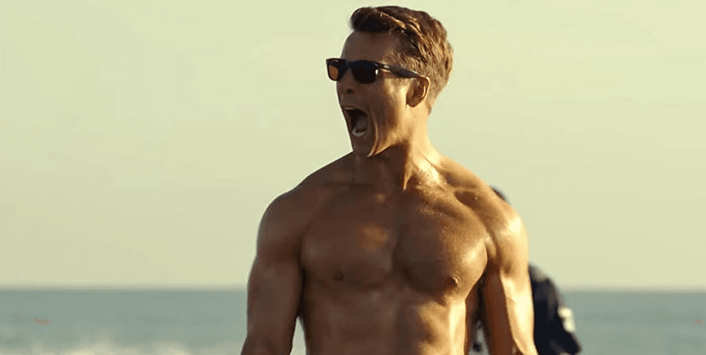 Glen Powell as Lt. Jake "Hangman" Seresin, mission pilot trainee, in a beach football game meant for team bonding, in "Top Gun: Maverick." (Paramount Pictures)