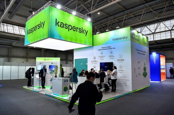 Visitors sit at the stand of Russian antivirus software development company Kaspersky Lab on the opening day of the MWC (Mobile World Congress) in Barcelona, Spain, on Feb. 28, 2022. (Pau Barrena/AFP via Getty Images)