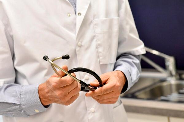 A doctor holds his stethoscope in this file photo. (Dirk Waem/Belga Mag/AFP via Getty Images)
