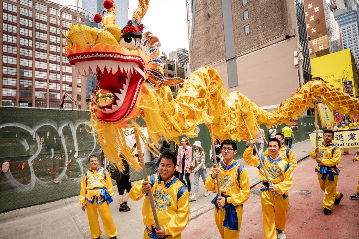 Falun Gong practitioners take part in a parade marking the 30th anniversary of its introduction to the public, in Manhattan, New York, on May 13, 2022. (Samira Bouaou/The Epoch Times)