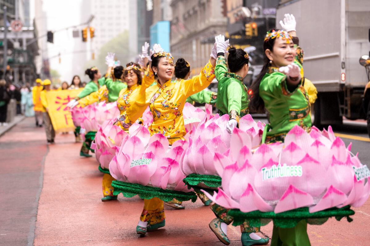 Falun Gong practitioners take part in a parade marking the 30th anniversary since it's introduction to the public, in Manhantan, New York City, on May 13, 2022. (Samira Bouaou/The Epoch Times)