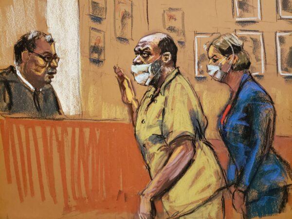 In this courtroom sketch, Frank James, who is charged with last month's mass shooting in a Brooklyn subway, is sworn in before pleading not guilty to terrorism and weapons charges in a courtroom in New York City, on May 13, 2022. (Jane Rosenberg/Reuters)