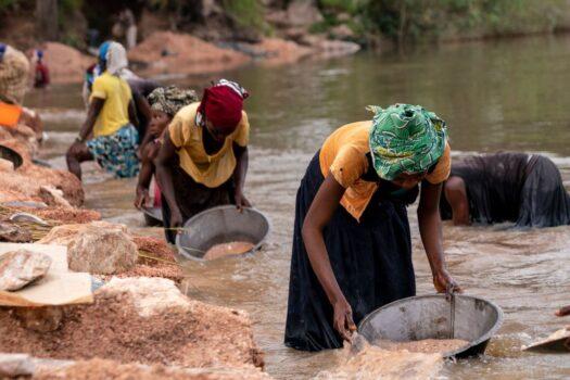 Artisanal miners collect gravel from the Lukushi river searching for cassiterite in Manono, the Democratic Republic of Congo on Feb.17, 2022.<br/>(Junior Kannah/AFP via Getty Images)