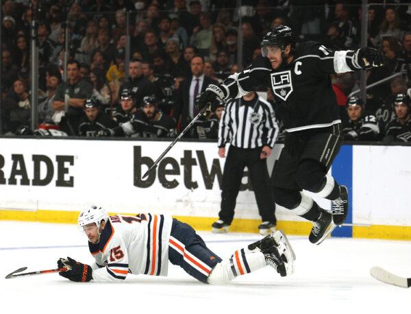 Anze Kopitar #11 of the Los Angeles Kings reacts as he jumps over Josh Archibald #15 of the Edmonton Oilers during the first period in Game Six of the First Round of the 2022 Stanley Cup Playoffs at Crypto.com Arena, in Los Angeles, on May 12, 2022. (Harry How/Getty Images)