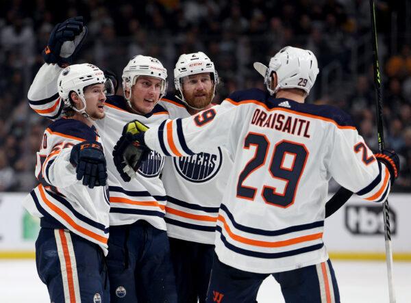 Tyson Barrie #22 of the Edmonton Oilers celebrates his goal with Kailer Yamamoto #56, Duncan Keith #2 and Leon Draisaitl #29, to take a 3-2 lead over the Los Angeles Kings, during the third period in a 4-2 Oilers win in Game Six of the First Round of the 2022 Stanley Cup Playoffs at Crypto.com Arena, in Los Angeles, on May 12, 2022. (Harry How/Getty Images)