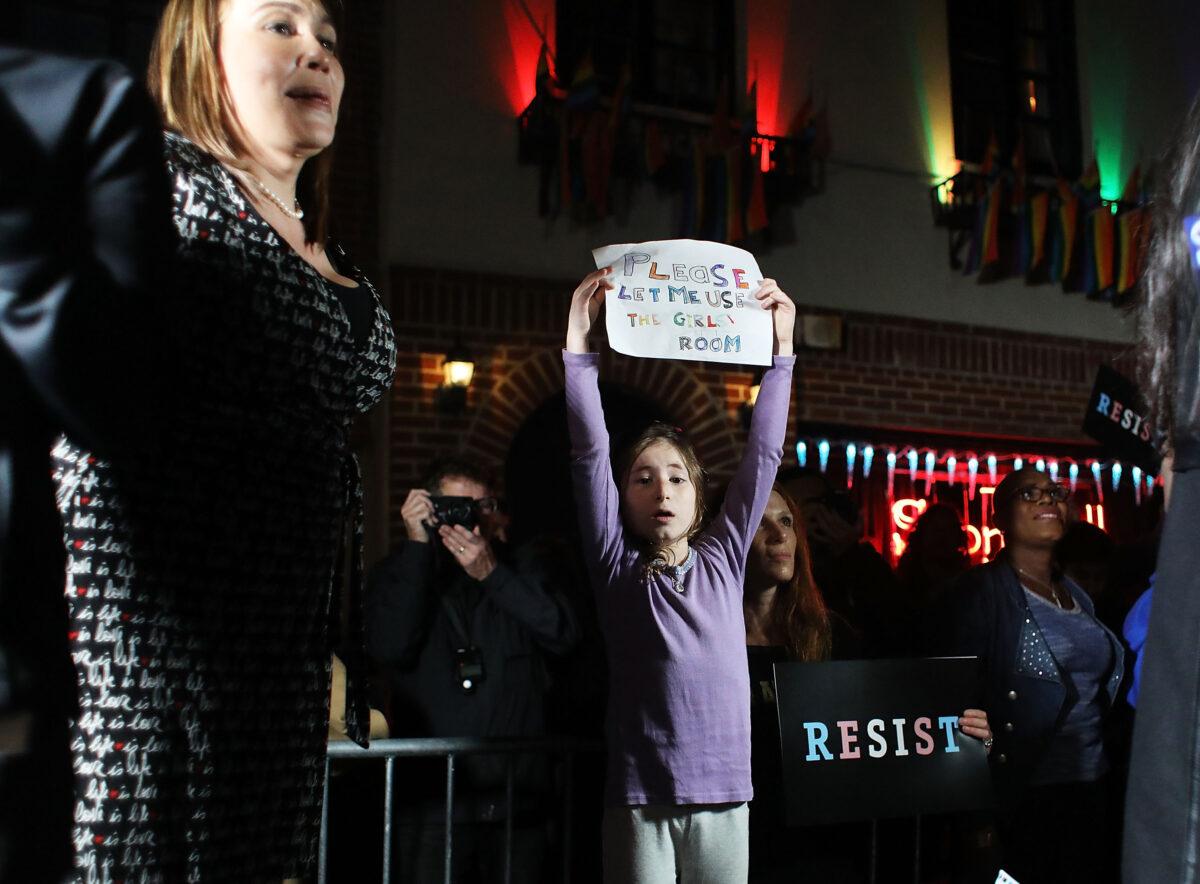 Activists and members of the transgender community protest a Trump administration announcement  rescinding an Obama-era order that allows transgender students to use school bathrooms matching their gender identities, at the Stonewall Inn in New York, on Feb. 23, 2017. (Spencer Platt/Getty Images)