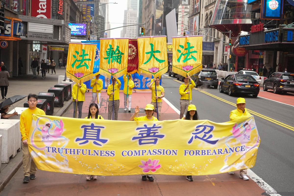 Falun Gong practitioners take part in a parade marking the 30th anniversary of its introduction to the public, in Manhattan, New York, on May 13, 2022. (Larry Dye/The Epoch Times)