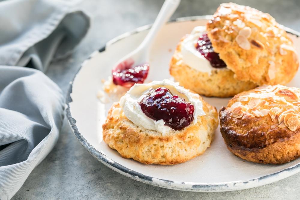 Serve your scones with clotted cream, if you can find it, and a dollop of jam. (Sokor Space/Shutterstock)