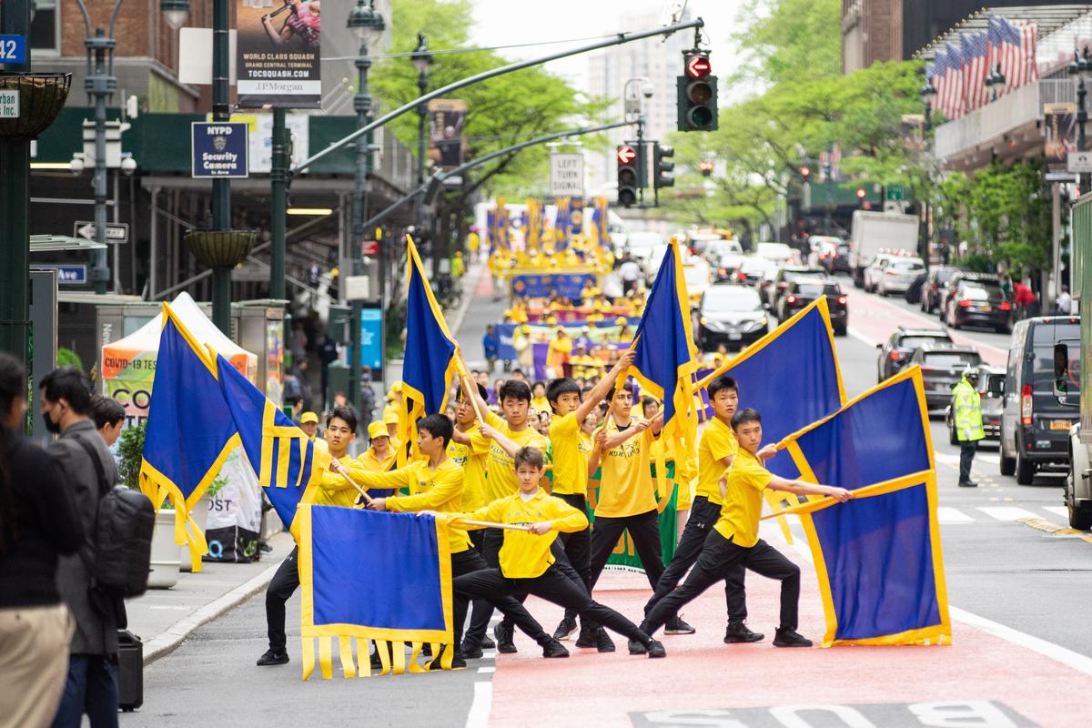 Falun Gong practitioners take part in a parade marking the 30th anniversary of its introduction to the public, in Manhattan, New York, on May 13, 2022. (Chung I Ho/The Epoch Times)