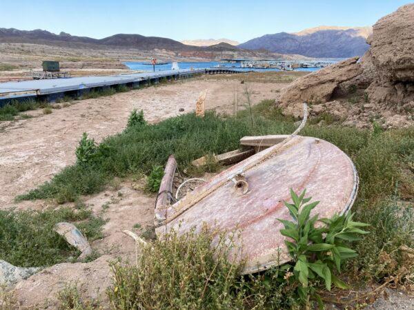 A sunken motorboat surfaced near the former 2021 water line in Lake Mead's Callville Bay on May 11, 2022. (Allan Stein/The Epoch Times)