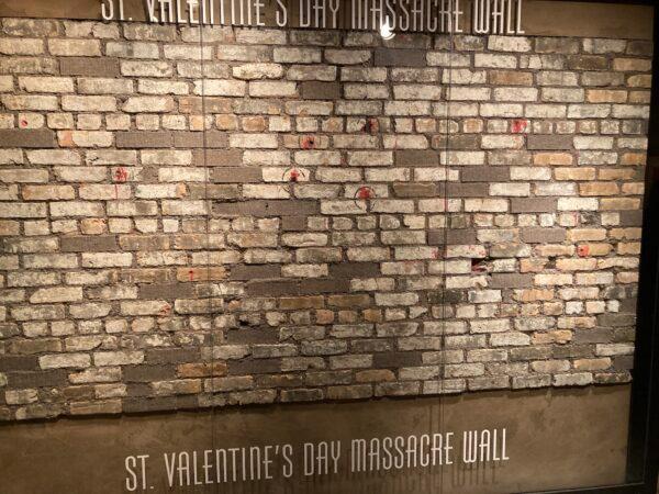 The St. Valentine's Day Massacre was the murder of seven organized crime members of Chicago on Feb. 14, 1929. In this photo, the actual wall still has bullets in them at The Mob Museum in Las Vegas, on May 12, 2022. (Allan Stein/The Epoch Times)