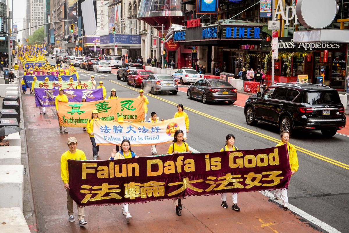 Falun Gong practitioners take part in a parade marking the 30th anniversary of its introduction to the public, in Manhattan, New York City, on May 13, 2022. (Larry Dye/The Epoch Times)