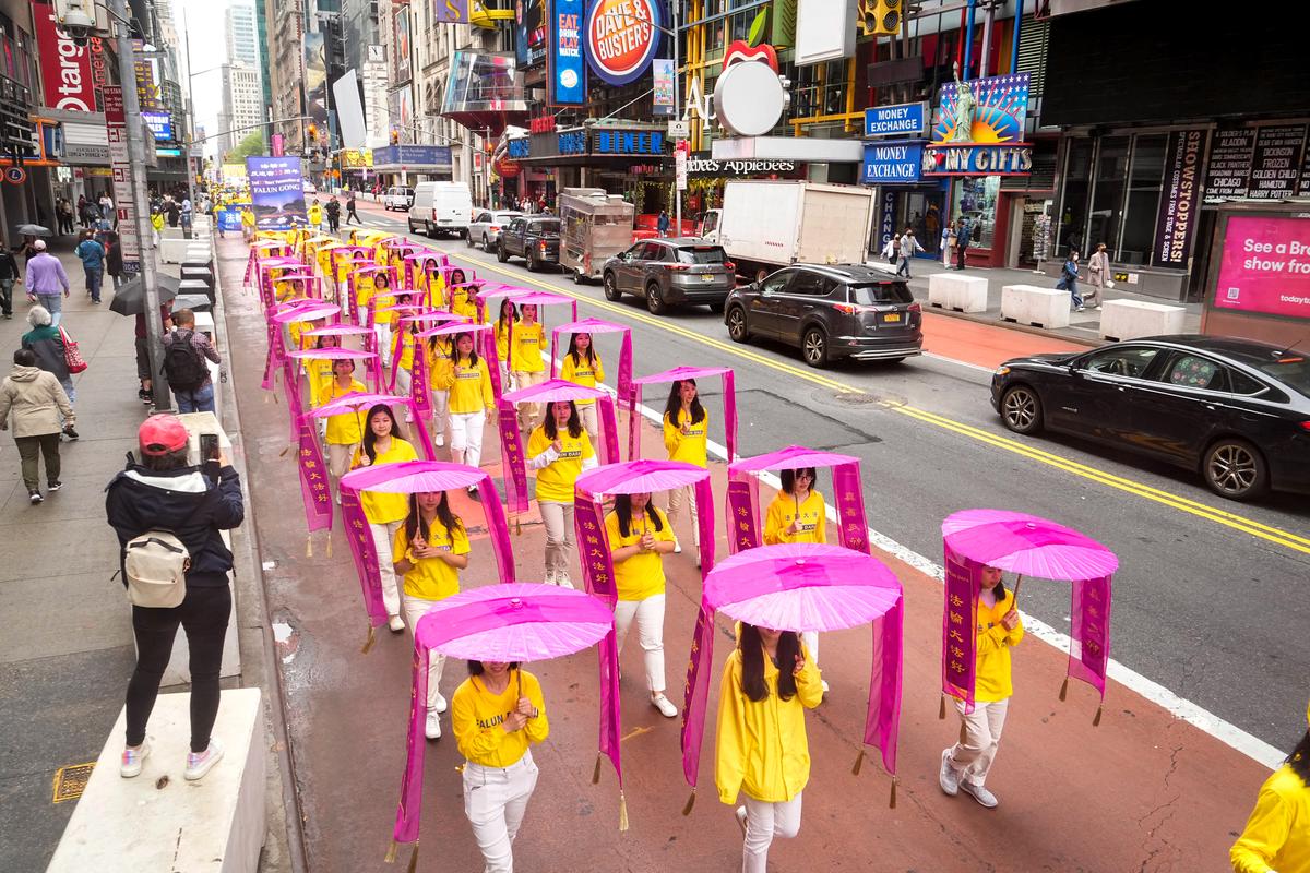 Falun Gong practitioners take part in a parade marking the 30th anniversary of its introduction to the public, in Manhattan, New York, on May 13, 2022. (Larry Dye/The Epoch Times)