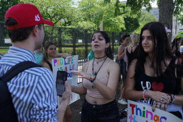 Pro-abortion protesters argue with Tyler, a pro-life protester outside the U.S. Supreme Court in Washington, D.C. on May 15, 2022 (Jackson Elliott/The Epoch Times)