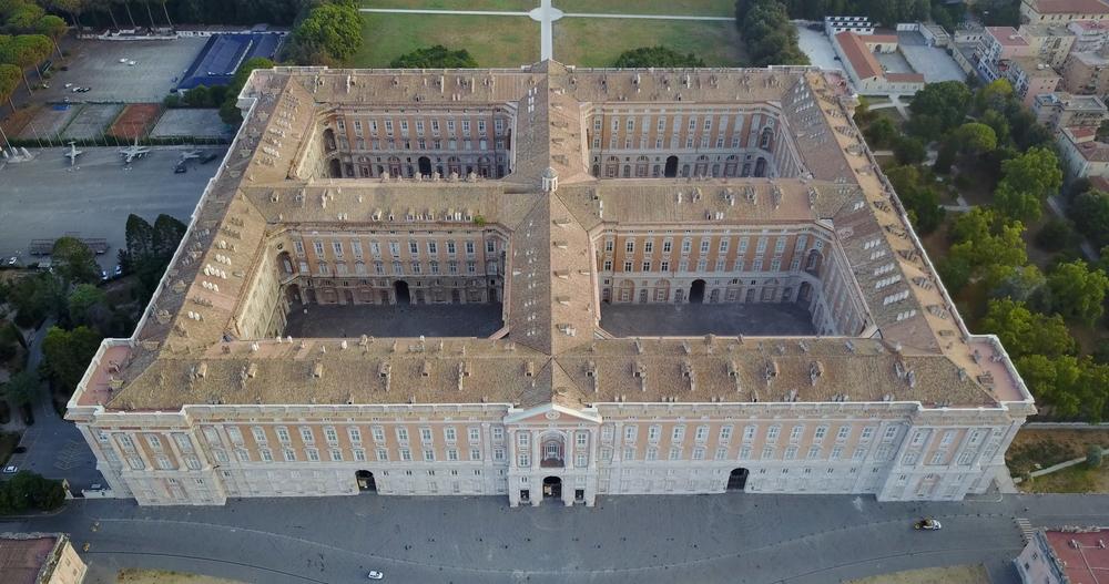 An aerial view of the palace is necessary to understand its true immensity. Its 1,200 rooms are made possible by the palace's enormous rectangular plan with four orthogonal arms that create four inner courtyards. (pio3/Shutterstock)