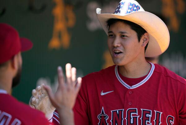 Shohei Ohtani #17 of the Los Angeles Angels celebrates in the dugout after hitting a two-run home run against the Oakland Athletics in the top of the firs inning at RingCentral Coliseum, in Oakland, Calif., on May 15, 2022. (Thearon W. Henderson/Getty Images)